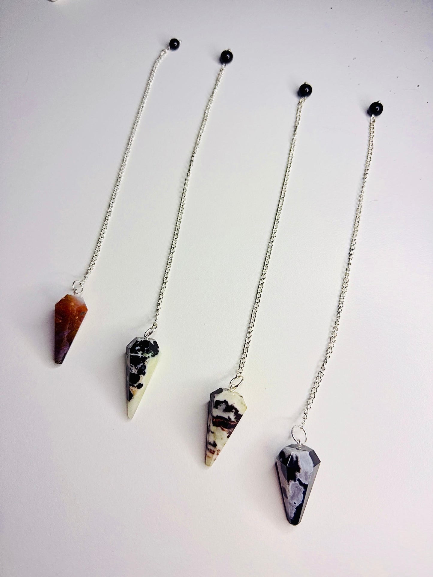 Black Sardonyx Pendulums ๐ค